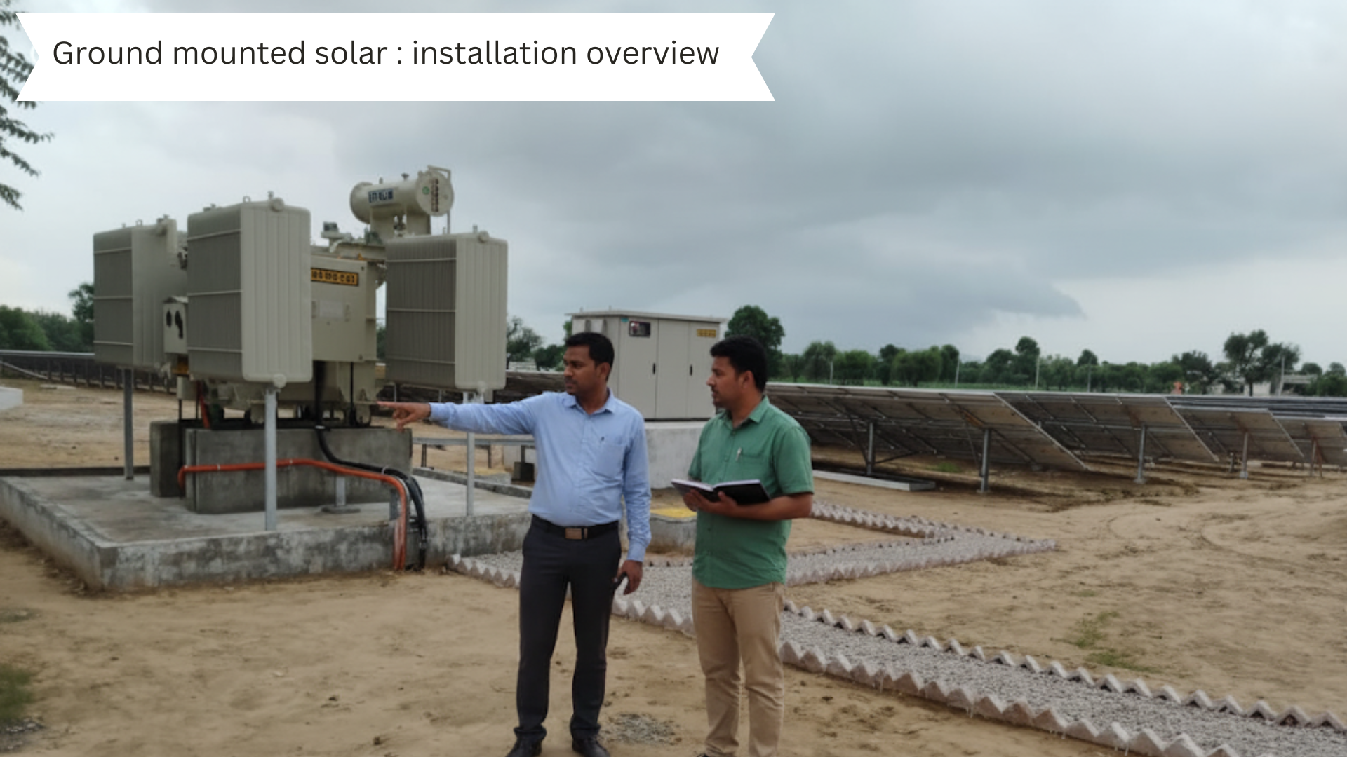 Workers installing ground-mounted solar panels, with one worker welding a metal frame