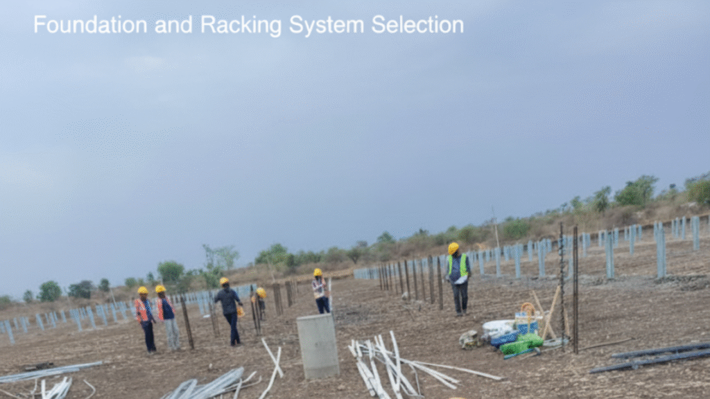 Workers installing the metal racking system for a ground-mounted solar project